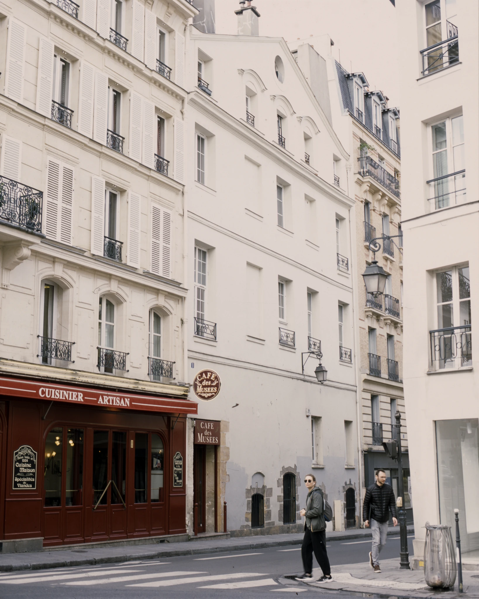 Street corner with pale apartment buildings